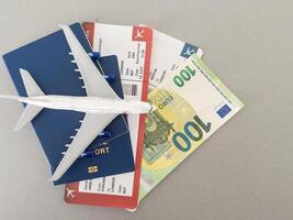 Top view of traveler accessories, passports and air tickets on background with copy space for text. Travel vacation concept photo