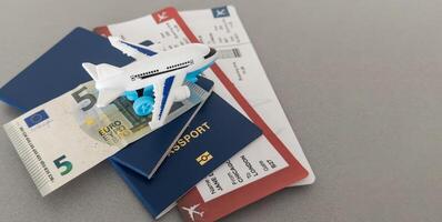 Top view of traveler accessories, passports and air tickets on background with copy space for text. Travel vacation concept photo