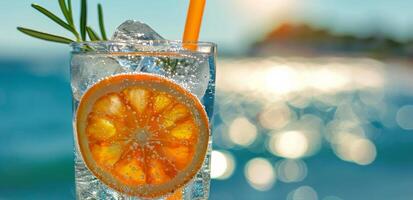 Refreshing Orange and Rosemary Drink on a Sunny Beach Day photo