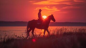 Man Riding Horse at Sunset photo
