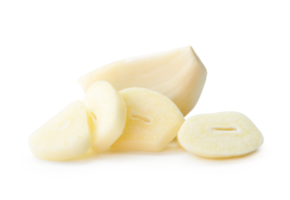 Side view of peeled garlic cloves with slices in stack isolated with clipping path and shadow in file format png