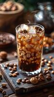 Glass of Beverage Surrounded by Nuts photo