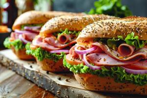 Three Ham and Cheese Sandwiches With Lettuce and Red Onion on a Wooden Board photo