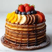 Stack of Pancakes Topped With Fruit and Chocolate photo