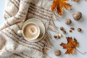 Warm Fall Morning Coffee With Blanket, Nuts, and Leaves photo