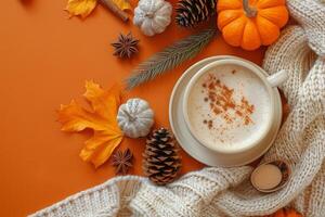 Cozy Autumn Scene With Pumpkin Spice Latte, Leaves, and Knitted Blanket photo