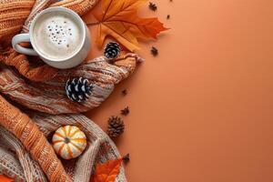 Cozy Autumn Scene With Pumpkin Spice Latte, Leaves, and Knitted Blanket photo