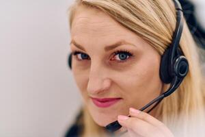 Friendly Call Center Agent Answering Incoming Calls with Headset Providing Remote Customer Service. photo