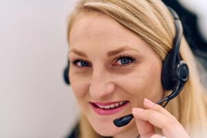 Friendly Call Center Agent Answering Incoming Calls with Headset Providing Remote Customer Service. photo