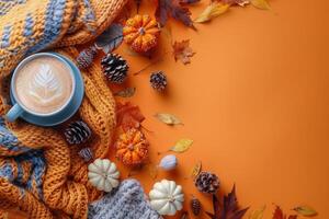 Cozy Autumn Scene With Pumpkin Spice Latte, Leaves, and Knitted Blanket photo
