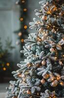 Decorated Christmas Tree With Lights and Ornaments Against a Grey Wall photo