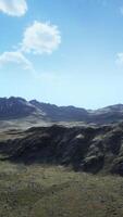 An aerial view of a mountain range in the mountains video