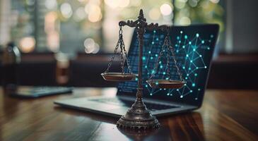 Justice Scales Resting on Open Laptop With Digital Network on Screen photo