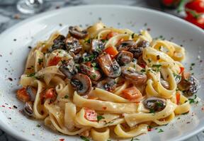 Creamy Mushroom Fettuccine Pasta With Herbs and Tomato photo