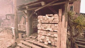 A stack of firewood next to a rustic building video