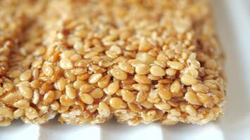 Closeup of Seed Brittle Square, with honey, seeds, and nuts, a nutritious snack video