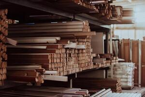 A vast warehouse in the forestry industry, showcasing a plethora of wooden products, including boards and various timber items neatly organized in storage photo