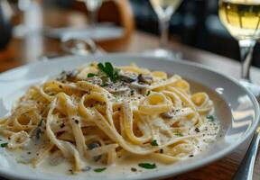 Creamy Mushroom Fettuccine Pasta With Herbs and Tomato photo