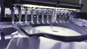 An embroidery machine producing stitched patterns with precision and craftsmanship video