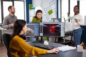 Engineer analysing cad software to develop game, working in startup creative company for prototype. Design technician studying on computer developing new online games with modern technology photo