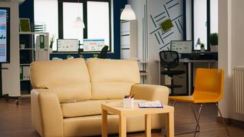 Empty start up business office with modern design and confortable couch. Financial company with nobody in it, place of work startup, workplace indoors concept photo