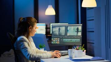 Videographer working at computer from business office, editing and audio footage at night. Content creator using professional device modern technology network wireless processing film montage. photo