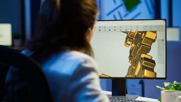 Focused woman architect working at new project using computer doing overtime at night sitting at desk in start-up office. Industrial female engineer studying on pc showing cad software in midnight photo