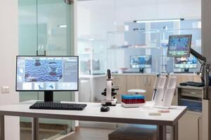 Interior of empty science laboratory with modern equipment prepared for pharmaceutical innovation using high tech, microbiology tools for scientific research. Vaccine development against covid19 virus. photo