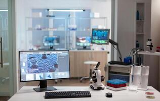 Chemist laboratory with nobody in it modernly equipped prepared for pharmaceutical innovation using high tech and microbiology tools for scientific research. Vaccine development against covid19 virus. photo