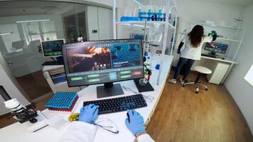 POV of chemist putting protection glasses, working at computer examining various bacteria in laboratory. Doctors analysing vaccine evolution using high tech researching diagnosis against covid19 virus photo