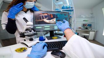 POV of scientists team worried about virus evolution discussing in modern equipped laboratory. Medical stuff examining vaccine development using high tech researching treatment against covid19 virus photo
