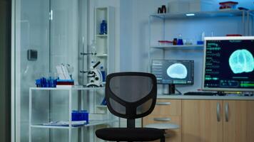 Neurological laboratory with nobody in it modernly equipped prepared for experiments development, examining brain functions, nervous system, tomography scan for scientific research. photo