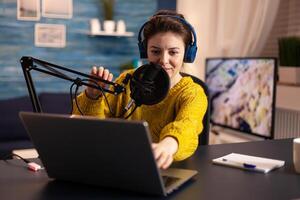 Blogger speaking with followers on live podcast using headphones. Creative online show On-air production internet broadcast host streaming live content, recording digital social media communication. photo
