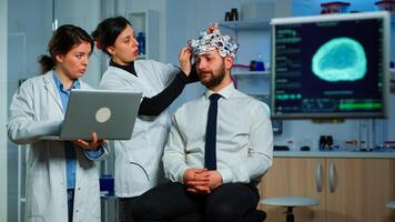 Women team neurological researchers working together developing treatment for diagnosis of braindisease, explaning eeg results, health status, brain functions, nervous system and tomography scan photo