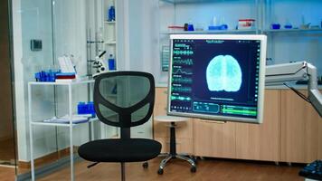 Medical brain scan film showing on monitor in neurology medical clinic. Technologically advanced and functional research office with nobody in it prepared for treatment innovation of nervous system photo