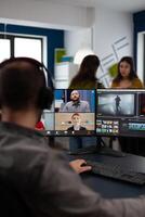 Senior editor director talking with creative team in web online meeting on call editing client footage work. Man getting feedback on movie using post production software on pc photo
