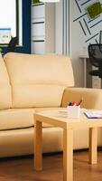 Interior of empty creative office with dusky light, new business, start up company with no people in it. Company with modern design and confortable couch with nobody in it, place of work startup photo