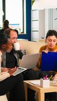 Multiethnic business team brainstorming on project during start up meeting, diverse employees group listening colleagues, sharing idea, discussing new marketing plan at professional group briefing photo
