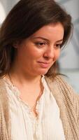 Close up of authentic happy professional employee sending mails sitting at desk in front of lapotop smiling, working financial startup company. Diverse team analyzes statistics data in modern office photo