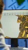 Focused woman architect working at new project using computer doing overtime at night sitting at desk in start-up office. Industrial female engineer studying on pc showing cad software in midnight photo
