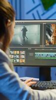 editor working at night at new project editing audio film montage sitting in start-up business office. Woman content creator using professional computer, modern technology, network wireless photo