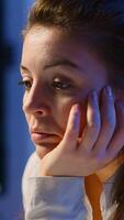 Businesswoman who worked until midnight on project falling asleep in front of laptop in start up company office, resting on hand with closed eyes. Employee using technology network doing overtime photo