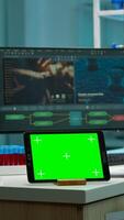 Notepad with green screen working in labooratory with mock up monitor, chroma key display while professional engineer testing virus evolution in background. High tech development lab. photo