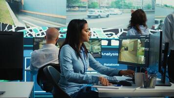 Indian employee collecting and transmitting information to couriers, locating the destination and sending the gps coordinates for faster order delivery. Dispatch call center operator. Camera B. photo