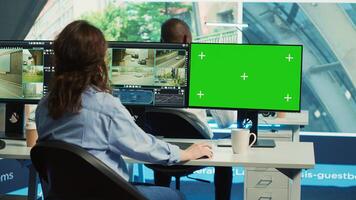 Agency operator monitoring traffic through radar surveillance with a mockup layout, using greenscreen next to CCTV footage. Employee gathering data on cars, satellite sensors. Camera A. photo