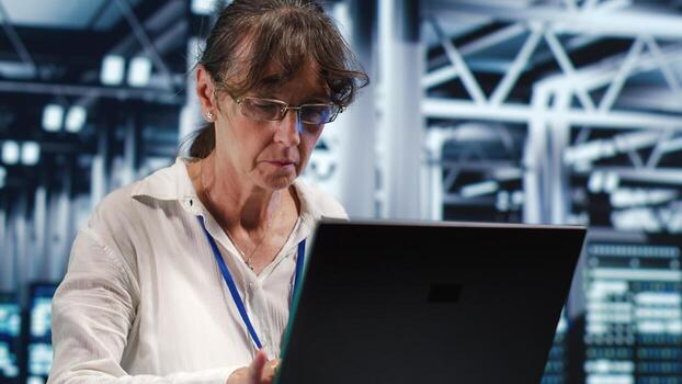 Knowledgeable repairman working in high tech workspace housing GPU dedicated servers that can process AI tasks with high efficiency, patching up rigs used for machine learning showing flaws photo