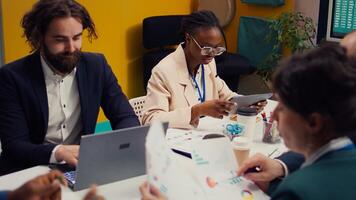 Management team developing new digital transformation initiatives in a boardroom meeting, enhance operational efficiency and agility. Employees improve organization workflow and performance. Camera B. photo