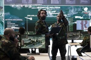 Military engineering team processes tactical data with reconnaissance radar CCTV system, creating battlefield maps to help soldiers during the defense operations. Collect intelligence for a mission. photo