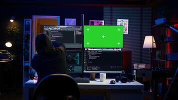 Cybercriminal uploading USB flash drive containing stolen information into green screen computer. Scammer inserting storage device into chroma key PC with data obtained from security breach, camera B photo