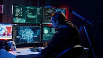 Hacker drinking coffee while running artificial intelligence spyware software designed to gather information from users. Script kiddie doing illegal stuff using AI, consuming beverage, camera B photo